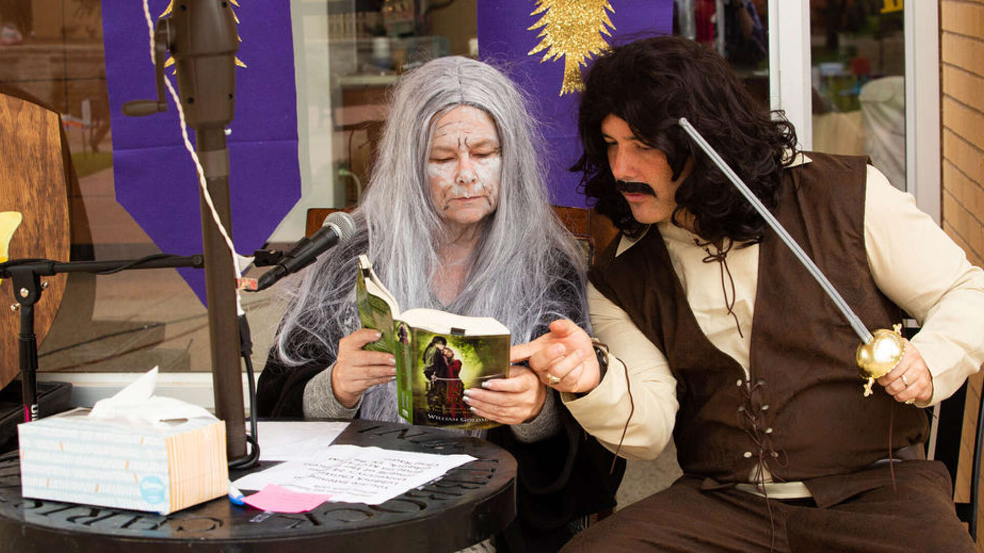 Dr. Carole Carroll and Dean of Students, Josh Stephens, in costume reading "The Princess Bride" 