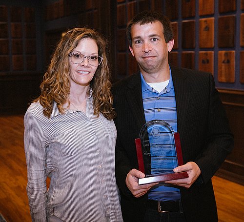 Dr. Cary Chisholm with award