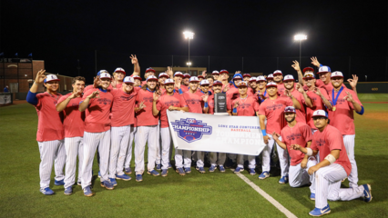 LCU Baseball team with championship banner