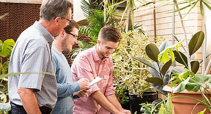 Dr. Kirt Martin instructing students in the LCU greenhouse