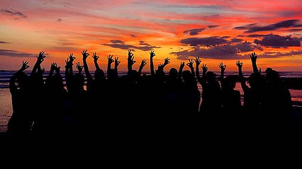 Lady Chap soccer team puts their chap hand sign up against the Costa Rica sunset