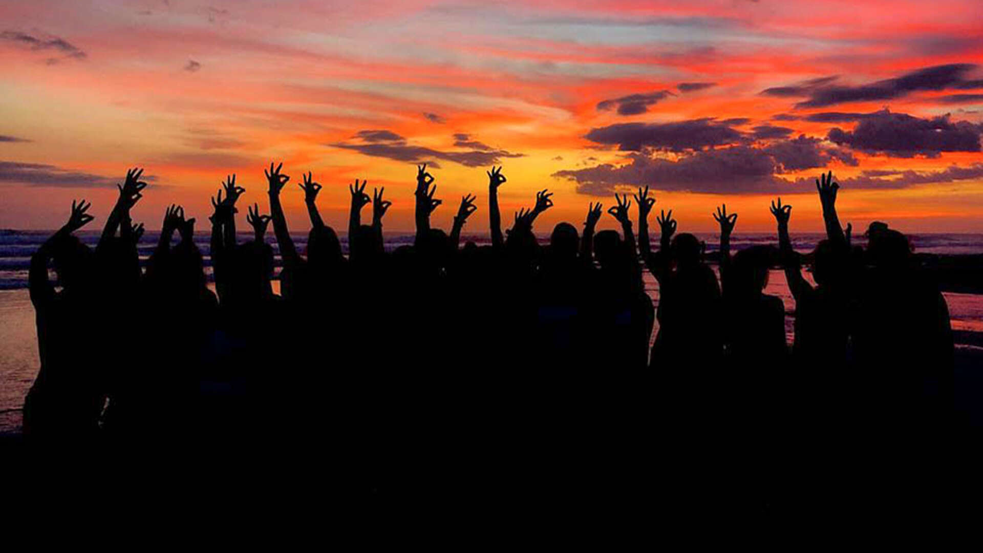 Lady Chap soccer team puts their chap hand sign up against the Costa Rica sunset