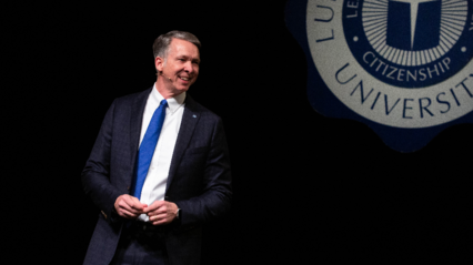 President Scott McDowell speaking on stage at chapel