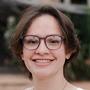 Headshot photograph of Madison