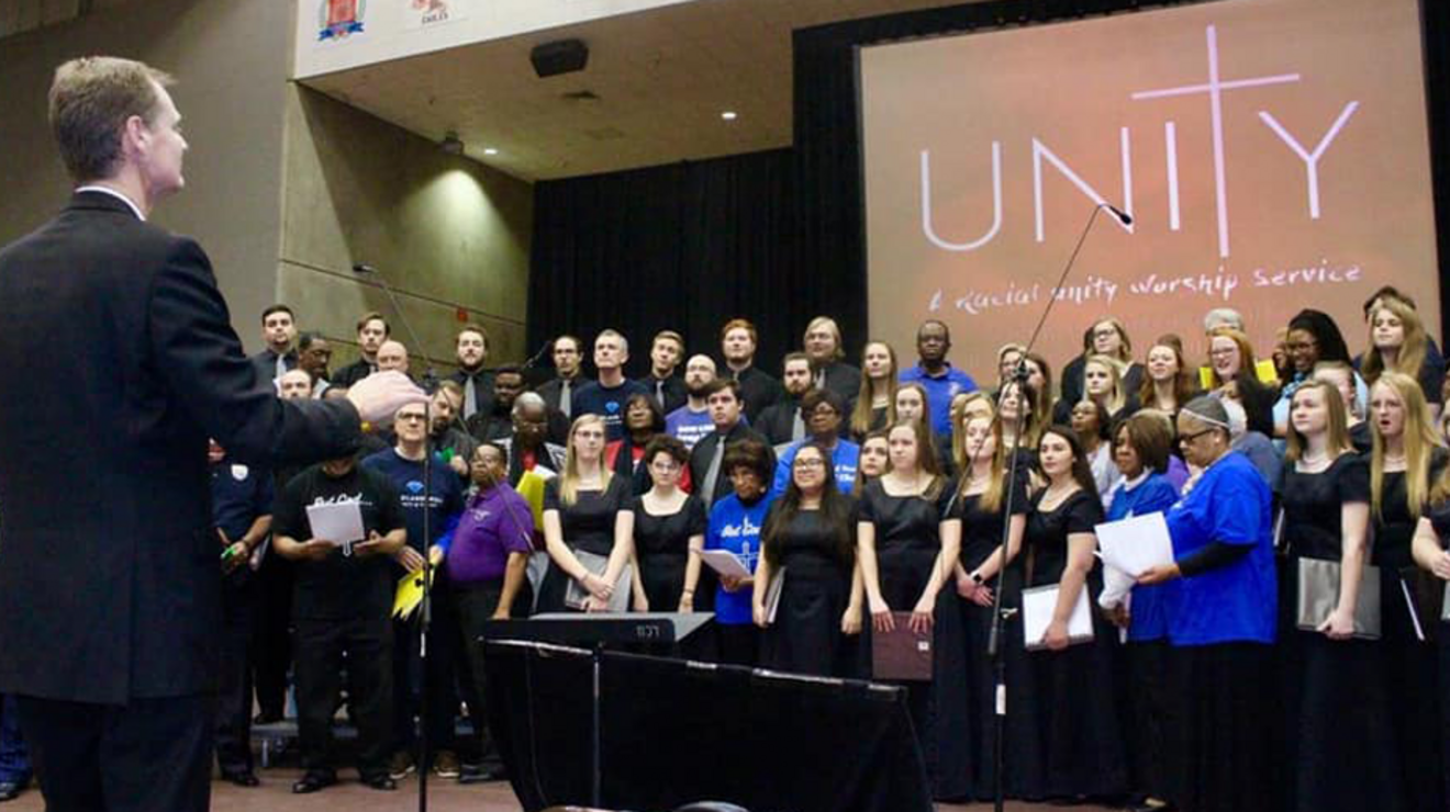 Philip Camp directing the racial unity choir