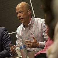 Man talking to a group of people