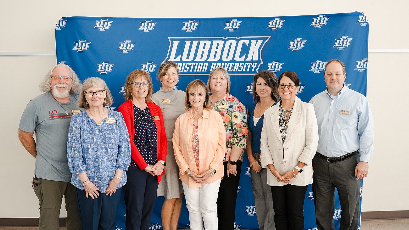 LCU Nursing Faculty posing in front of media screen