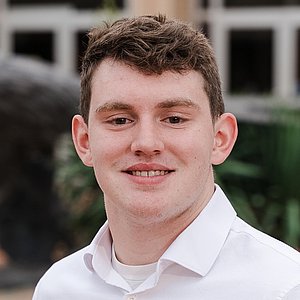 Headshot photograph of Duncan