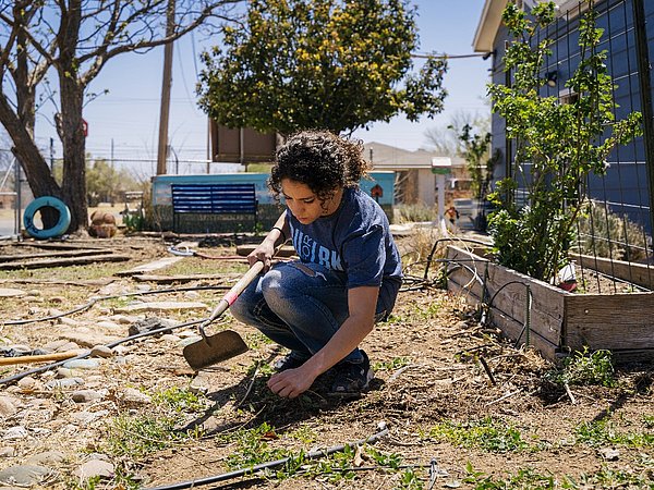 Female Student working in a community garden