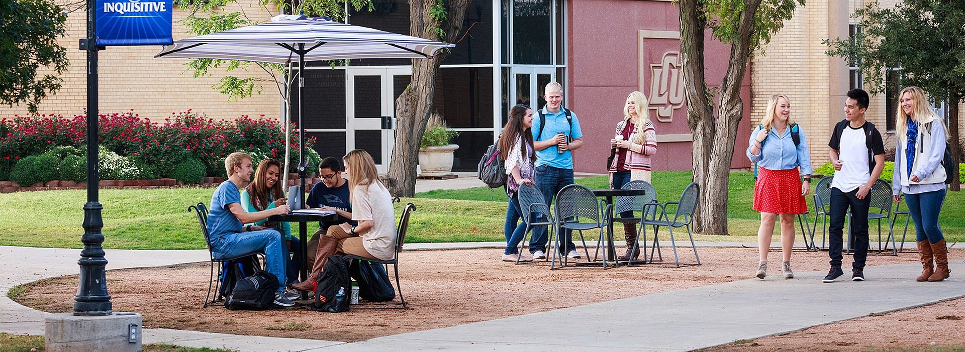 6 students talking outside in the LCU mall area