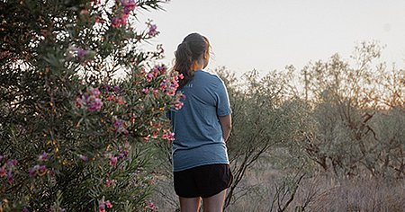 Girl looking over field