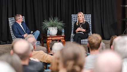 Photo of Dr. Amy Orr-Ewing and Dr. Kenneth Hawley sitting for a Q&A in front of a crowd