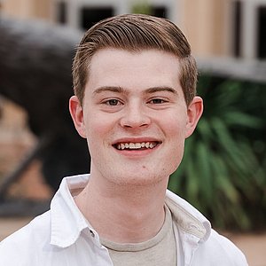 Headshot photograph of Ethan