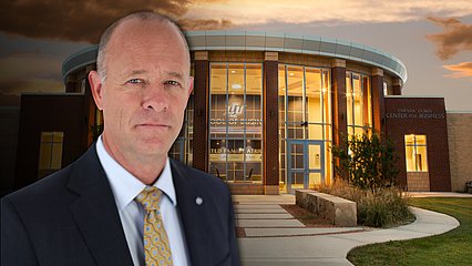 Tracy Mack in front of the School of Business