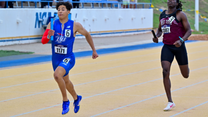 George Garcia finishing in first place in the 400m dash