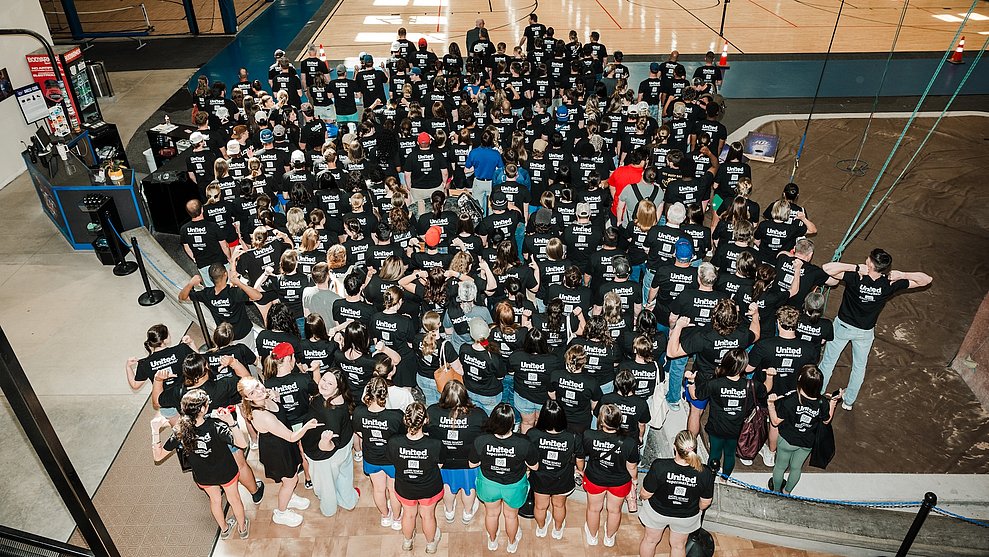 Overhead photograph of a crowd of LCU volunteers gathered before they head out to various service projects
