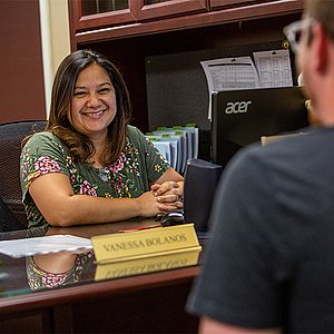 Student working with Registrar