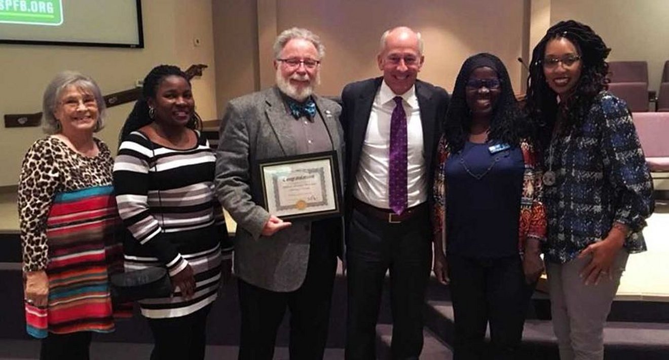 Dr. Mark Wilkinson accepting SPFB award