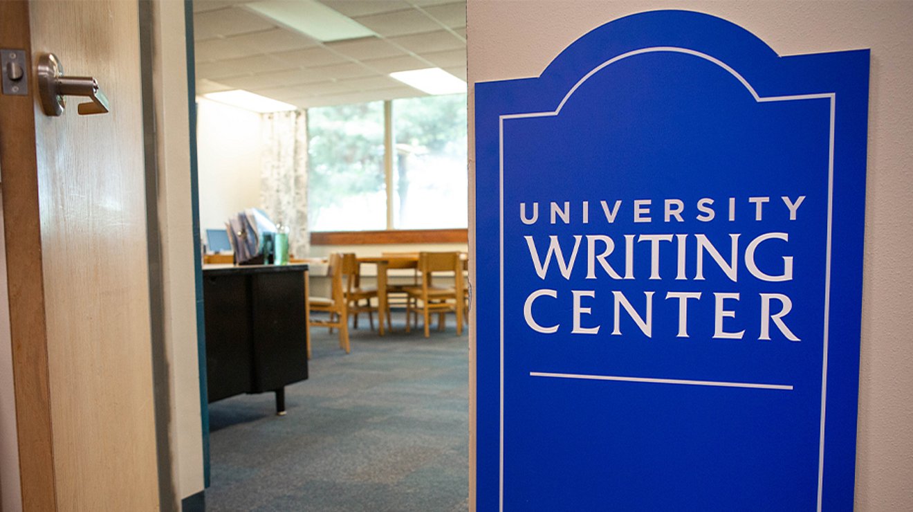 University Writing Center sign by open door of office