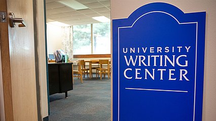 University Writing Center sign by open door of office