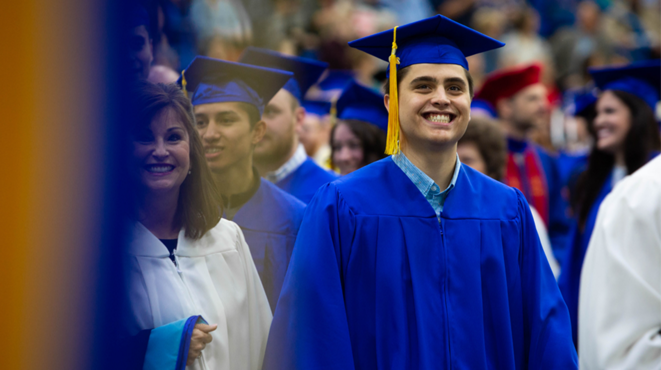 Student at graduation ceremony in regalia