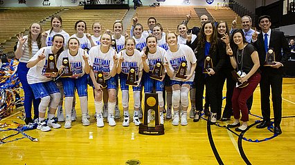 Lady Chap basketball team and coaches pose with national championship trophies