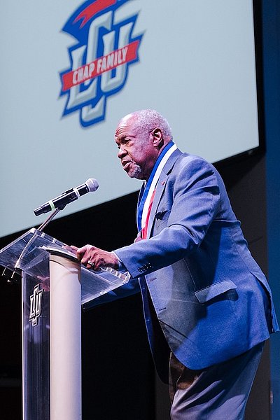 Photograph of Rob Evans speaking in Alumni Chapel