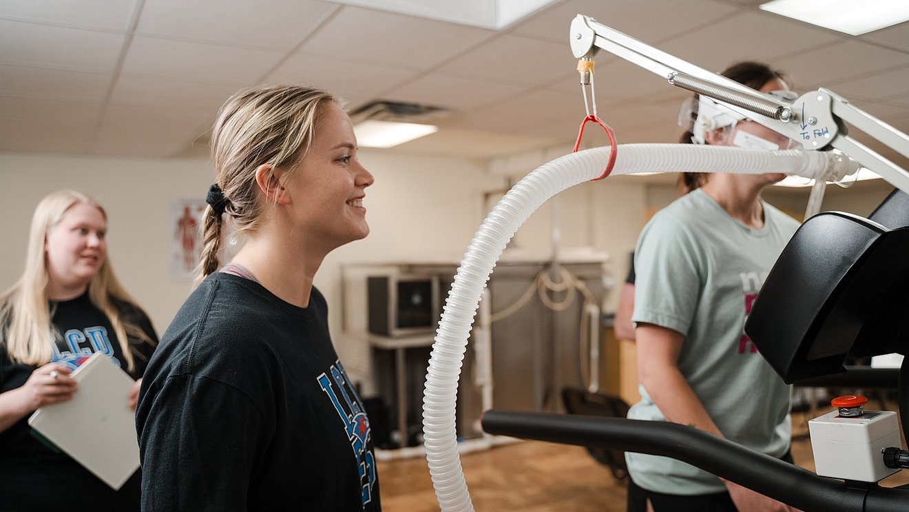 Master of Human Performance students working with lab equipment