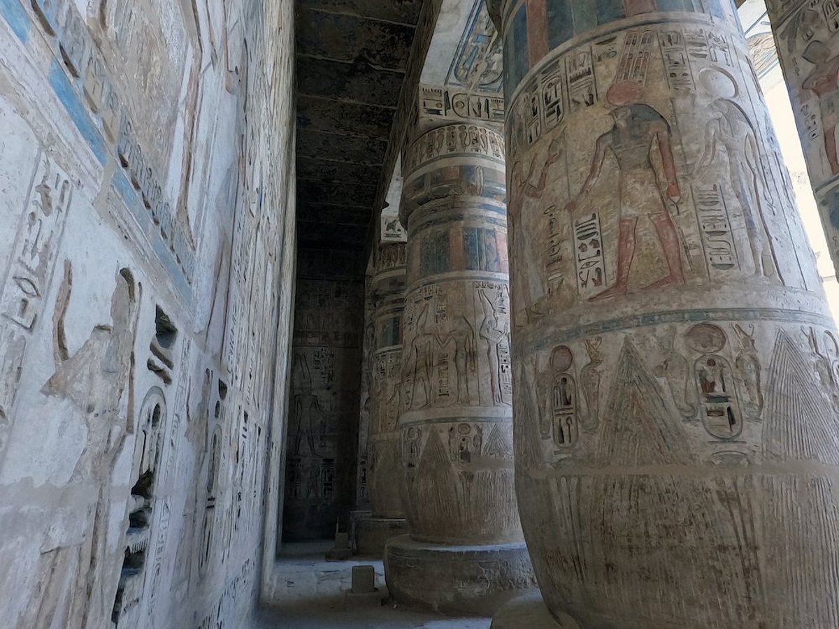 Columns in the Great Hypostyle Hall decorated with intricate Egyptian designs and colors