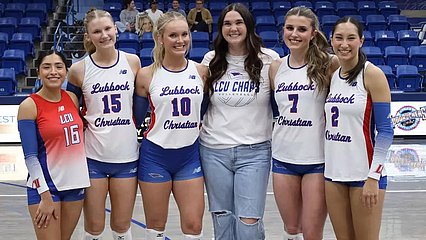 LCU Senior Volleyball players and student coach posing before the game Wednesday night