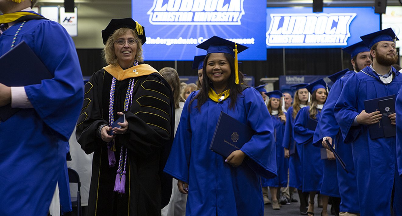 Graduates and Professors at commencement