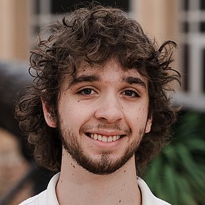 Headshot photograph of Malaki