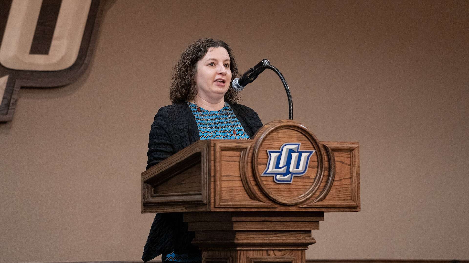 Dr. Olga Pahom speaking at a conference