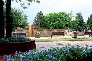 Looking a curved fountain outside with seating