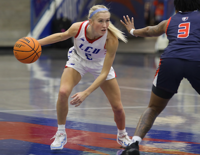 photo of Maci Mattox dribbling a basketball in a game