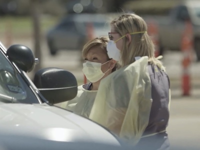 Philips and another nurse working a COVID drive-through testing site