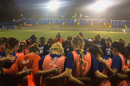 Lady Chap soccer team prays before match in Costa Rica