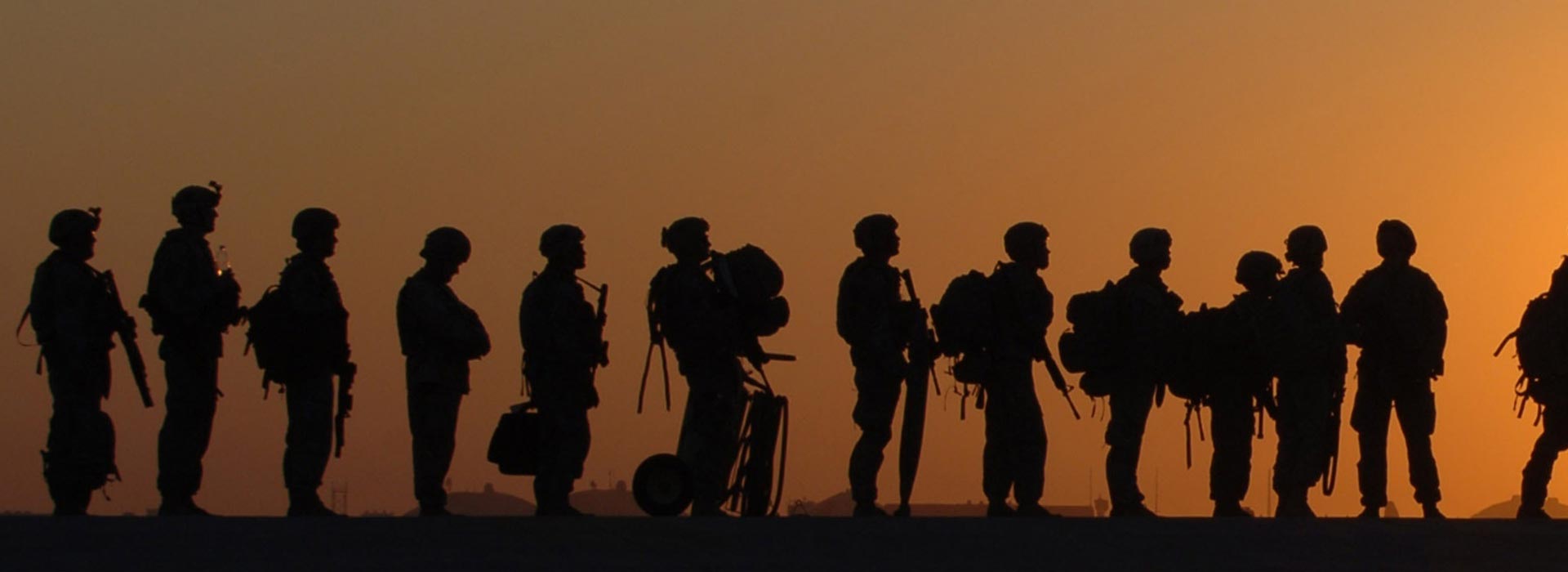 Silhouette of soldiers at sunset