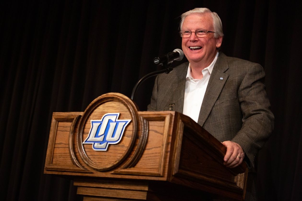 Terry Creech speaking at podium