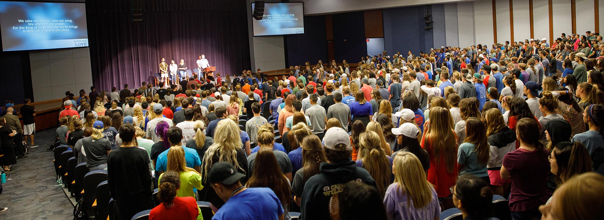 In the McDonald Moody Auditorium from behind audience looking at stage