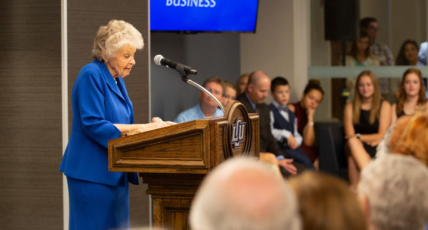 Christa Dobbs addresses the standing-room-only crowd at the dedication