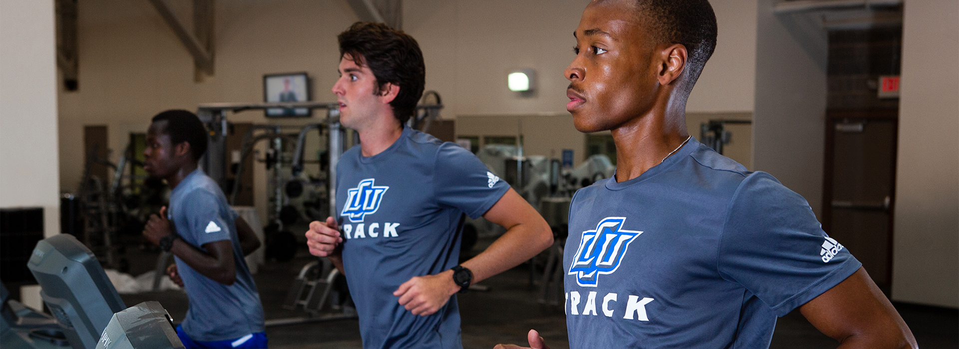 student athletes running on treadmills in the LCU rec center